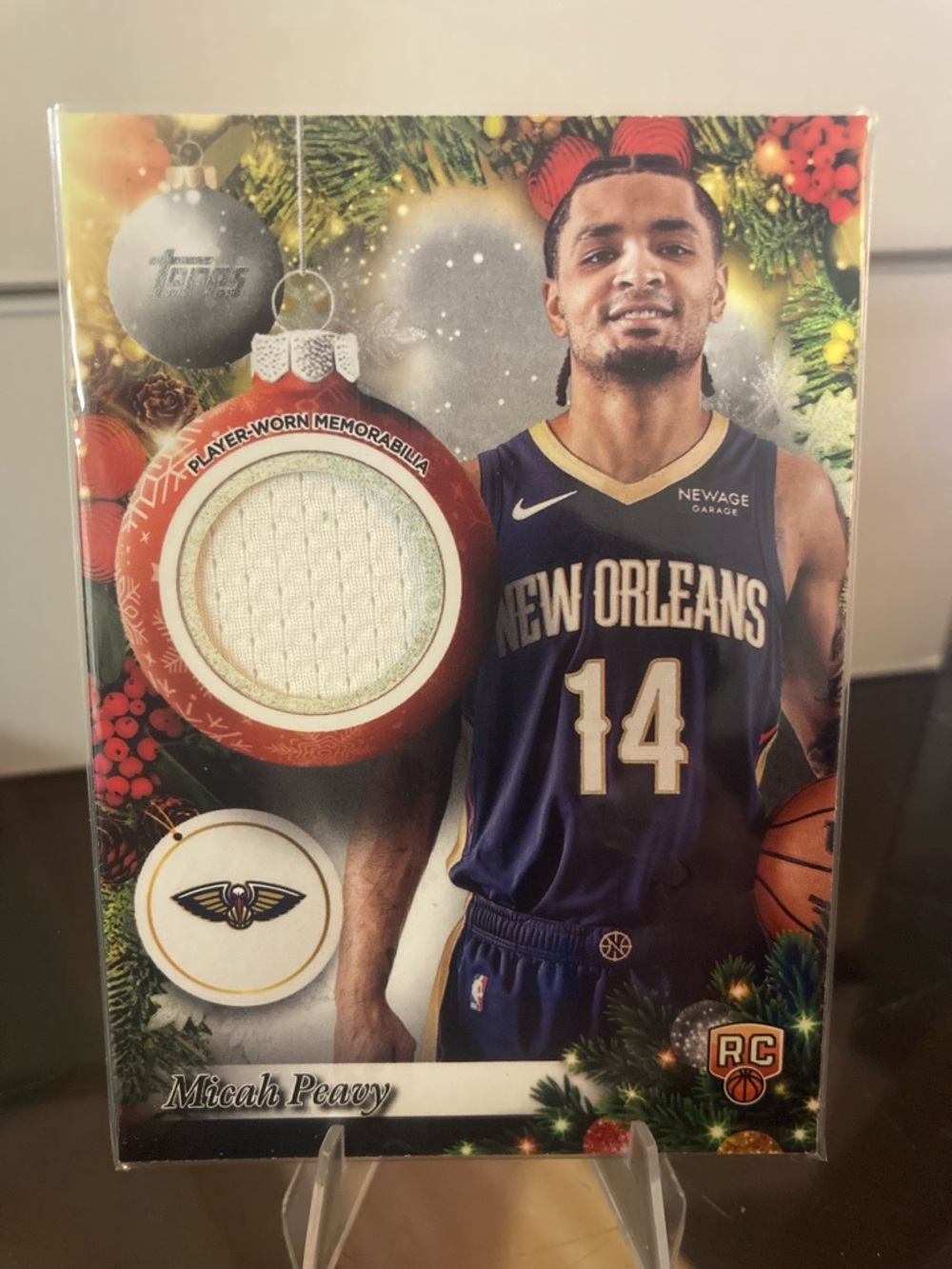 New Orleans Pelicans Micah Peavy Holiday Player-Worn Memorabilia Card - Navy